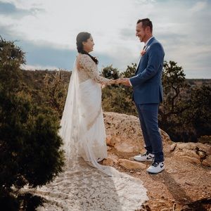 White saree embroider with pearls and long train